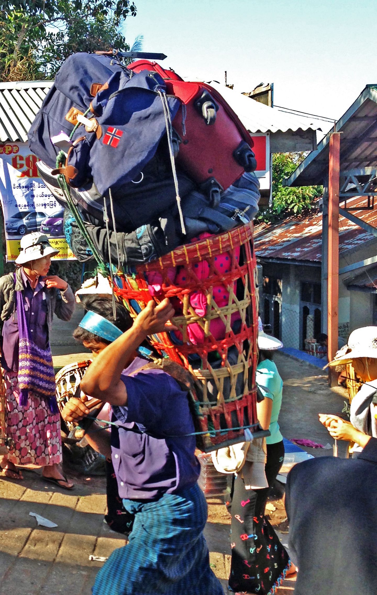 Sherpa carrying luggages at the Golden Rock, Myanmar