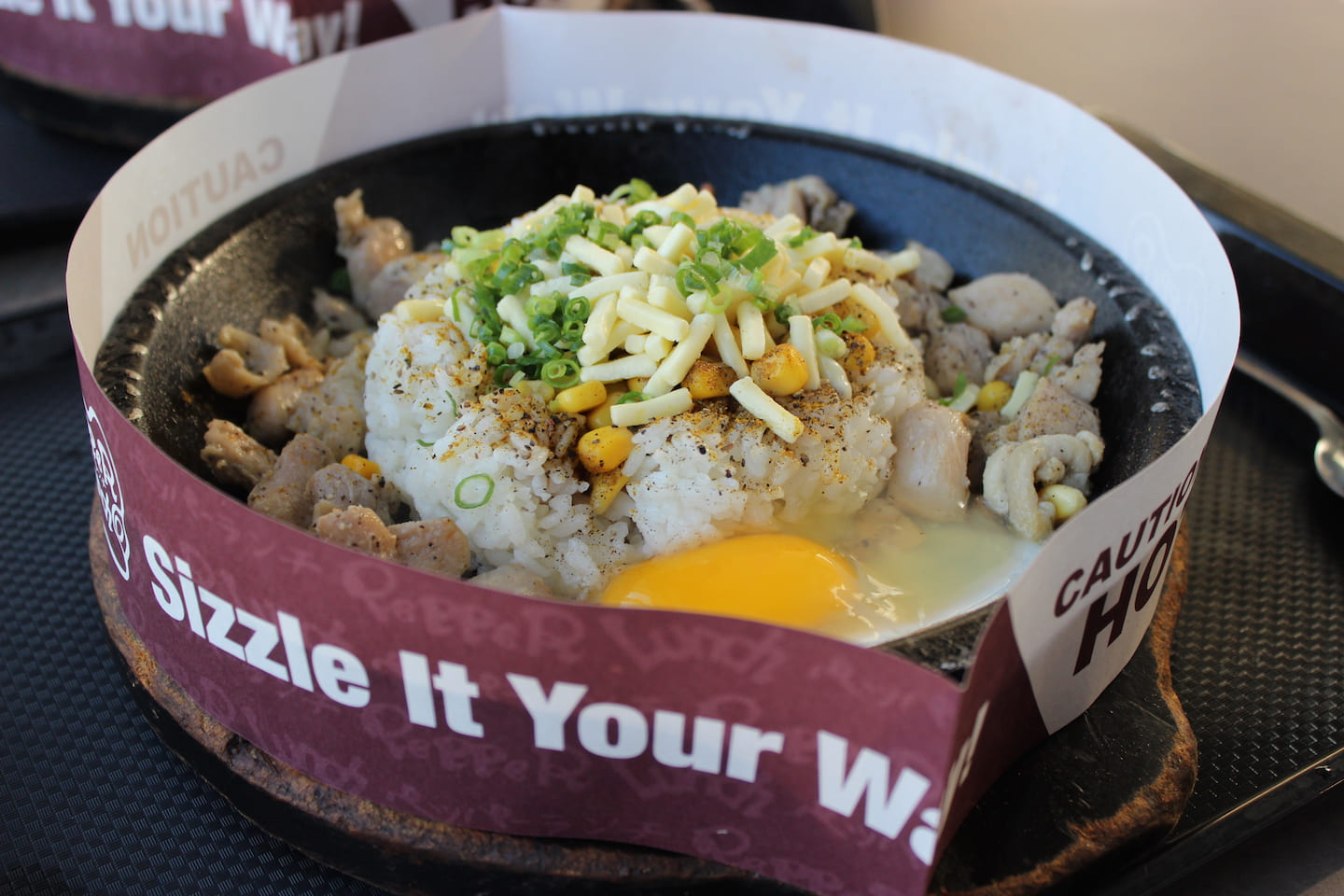 Sizzling meal of beef and rice with eggs.
