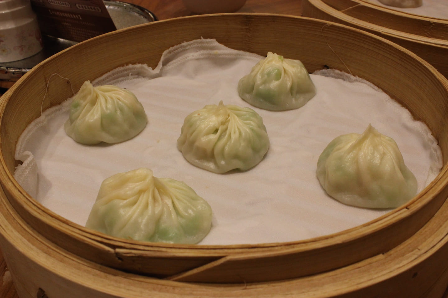 Soup dumplings with shrimp and green squash at Din Tai Fung. 