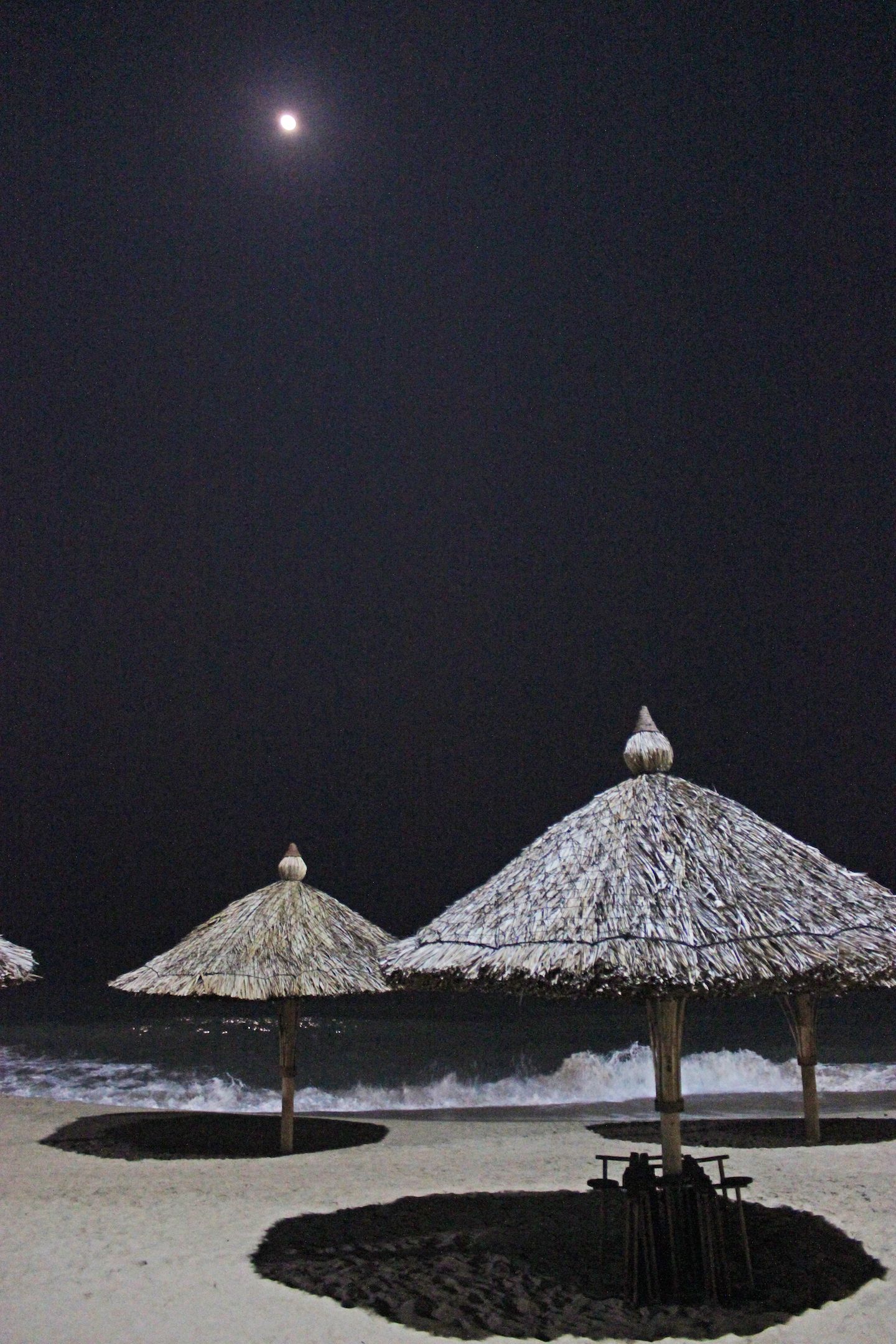 Straw hut at night