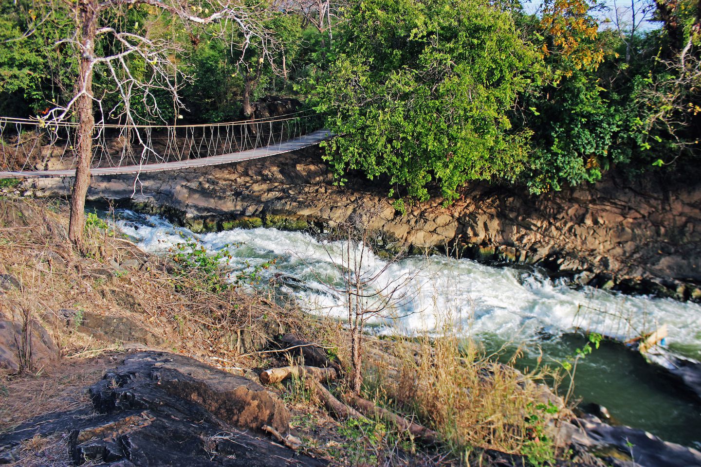 Suspension bridge over the waterfalls of the Mekong River, 4000 Islands (Si Phan Don), Laos