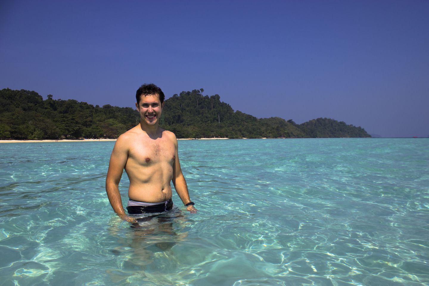 Carlos walking on the sand banks of Koh Kradan, Thailand