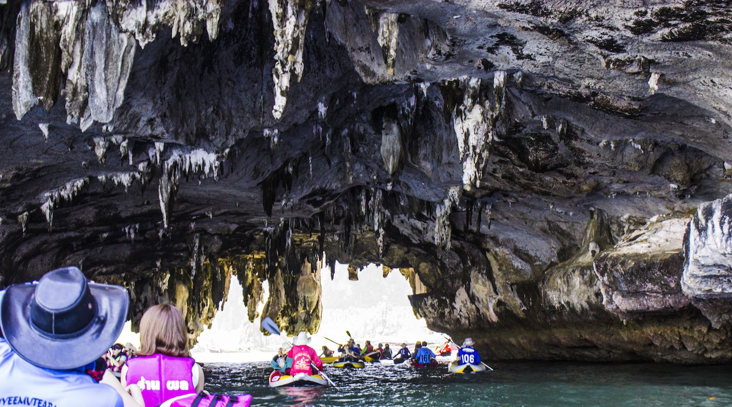 Canoeing through the cave of Talu Island, Phang Nga Bay, Thailand