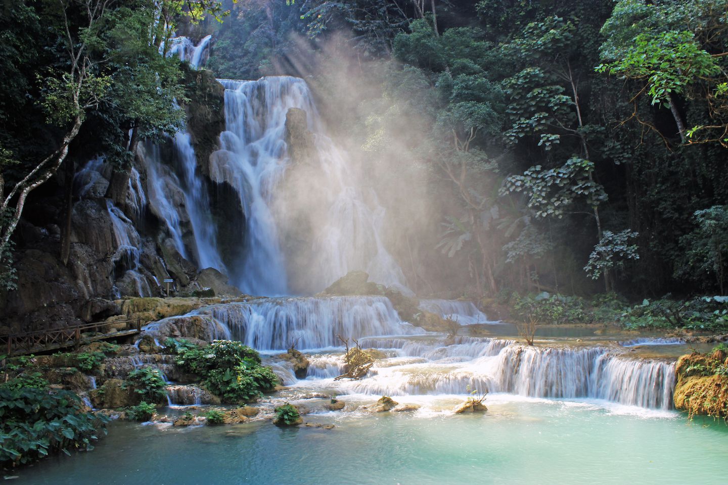 Water spray reflecting the sunlight at the Kuang Si Waterfall, Luang Prabang, Laos